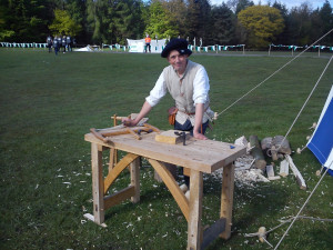 A medieval carpenter with his tools